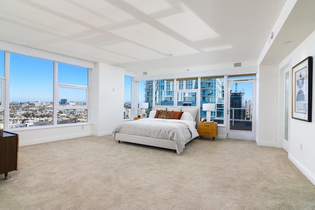 bedroom with light colored carpet and access to exterior