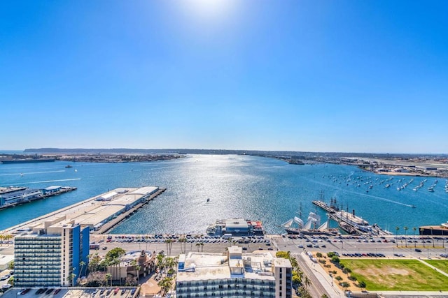 birds eye view of property with a water view