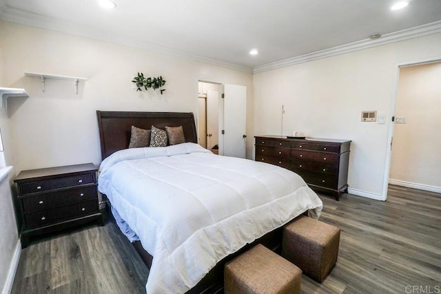 bedroom featuring crown molding and dark hardwood / wood-style floors