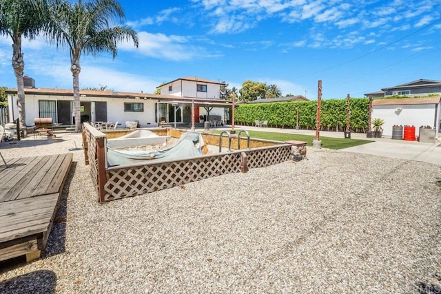 exterior space with a patio area and a wooden deck