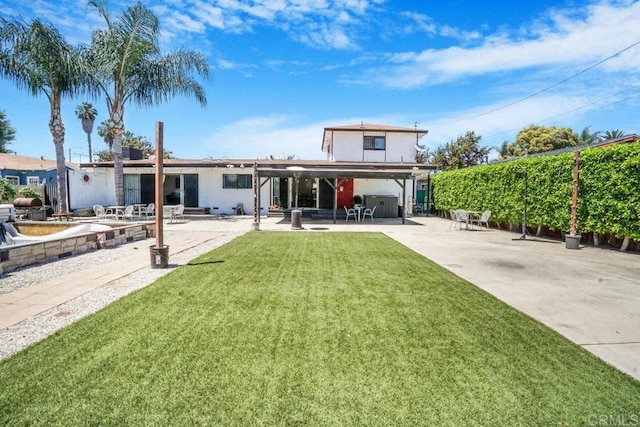 front of property featuring a patio and a front yard