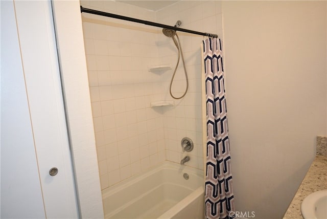 bathroom featuring vanity and shower / bath combo