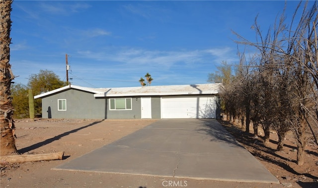 ranch-style home with a garage