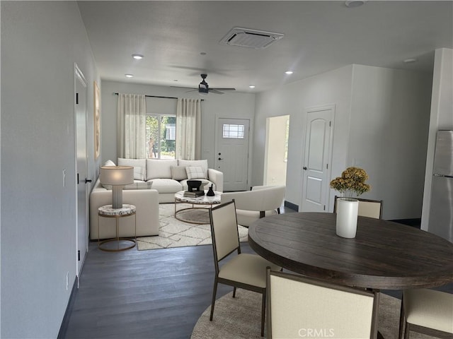 dining space with ceiling fan and hardwood / wood-style floors