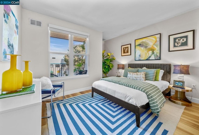 bedroom featuring wood-type flooring