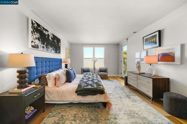 bedroom with light hardwood / wood-style floors