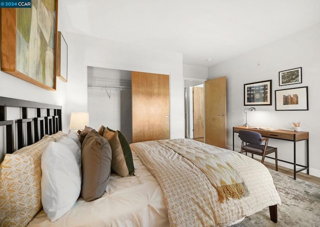 bedroom featuring a closet and hardwood / wood-style flooring