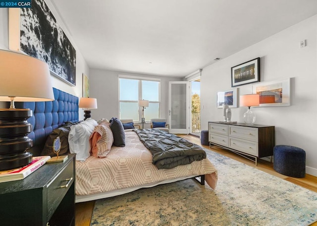 bedroom with light hardwood / wood-style flooring