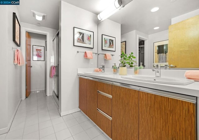 bathroom featuring tile flooring and dual bowl vanity