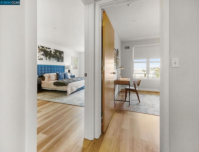 hall with light hardwood / wood-style floors