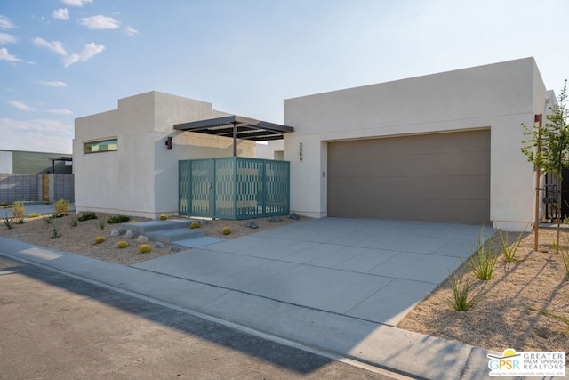 pueblo-style house with a garage