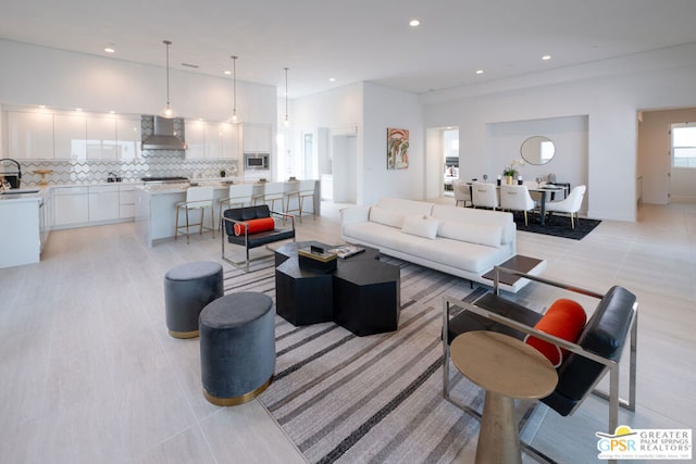 living room with sink and light tile patterned floors