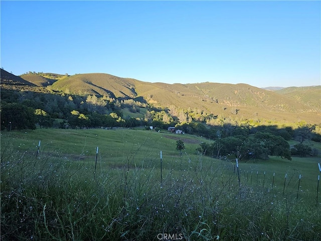 property view of mountains featuring a rural view