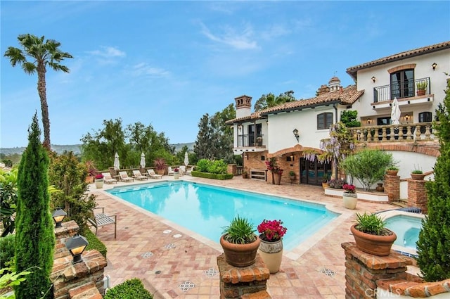 view of swimming pool with a patio area