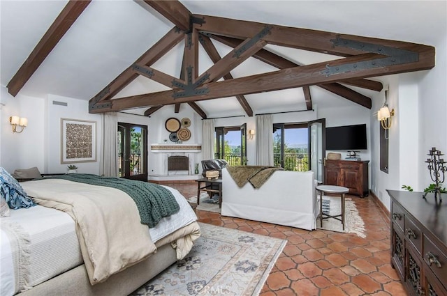 bedroom featuring lofted ceiling with beams, light tile patterned flooring, access to exterior, and multiple windows