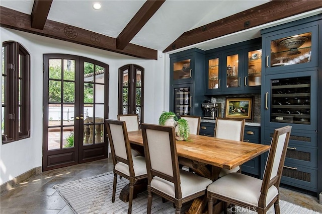 dining room with beamed ceiling, wine cooler, and french doors