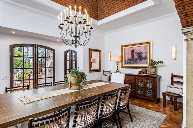 dining space featuring dark parquet flooring and crown molding