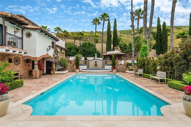 view of pool featuring a patio area