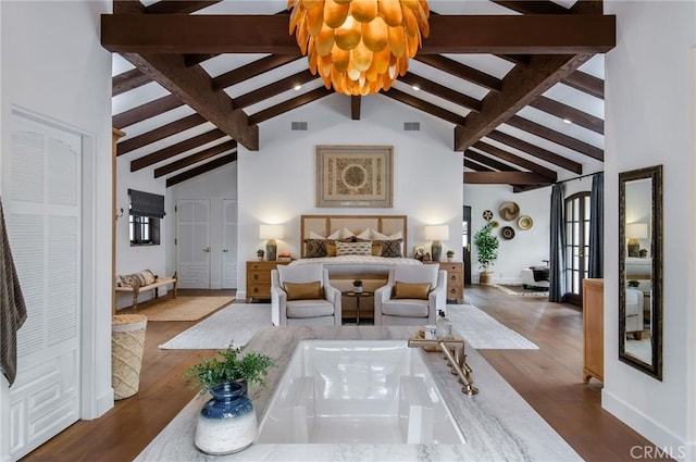 bedroom with beam ceiling, dark hardwood / wood-style floors, high vaulted ceiling, and a notable chandelier