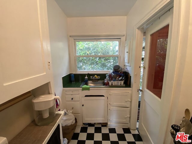 bathroom with sink and tile flooring