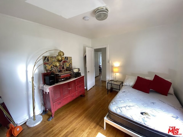 bedroom with wood-type flooring