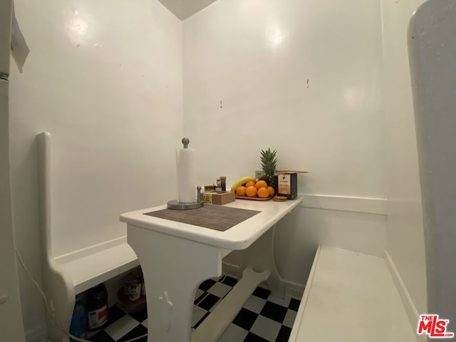 clothes washing area with tile floors