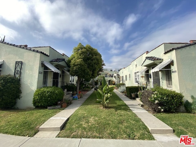 surrounding community featuring a yard