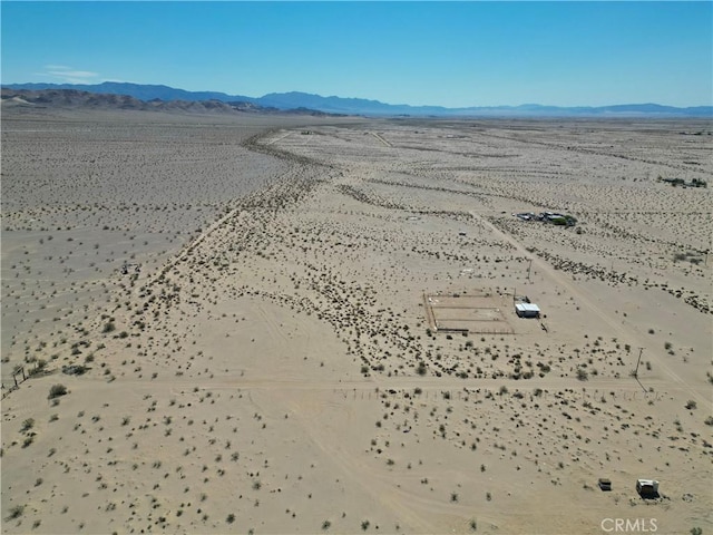 drone / aerial view featuring a mountain view