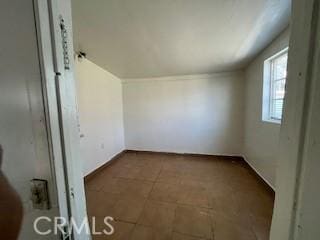 additional living space featuring vaulted ceiling