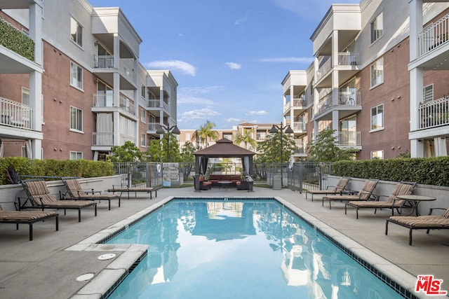 view of pool featuring a patio area and a gazebo