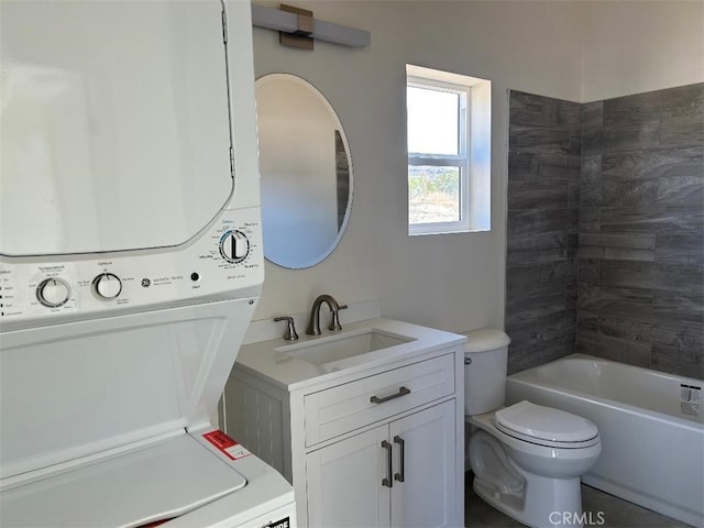 full bathroom featuring shower / bath combination, toilet, vanity, and stacked washing maching and dryer