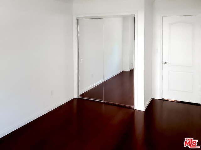 unfurnished bedroom with a closet