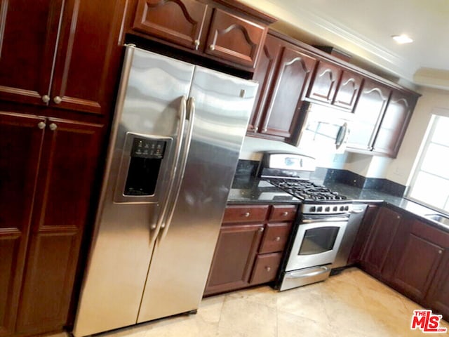 kitchen with crown molding and appliances with stainless steel finishes