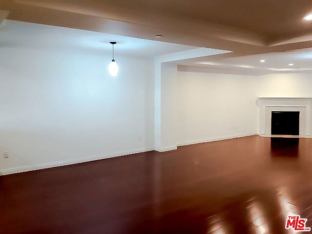 basement with hardwood / wood-style flooring