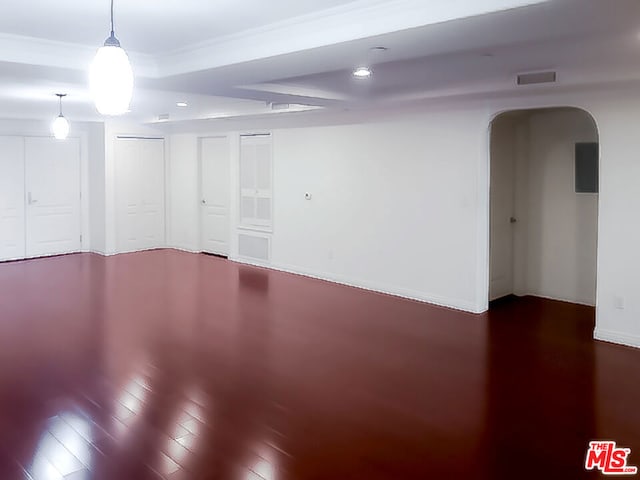 unfurnished room featuring hardwood / wood-style flooring