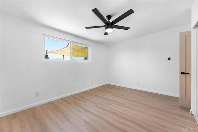 spare room with ceiling fan and light hardwood / wood-style floors