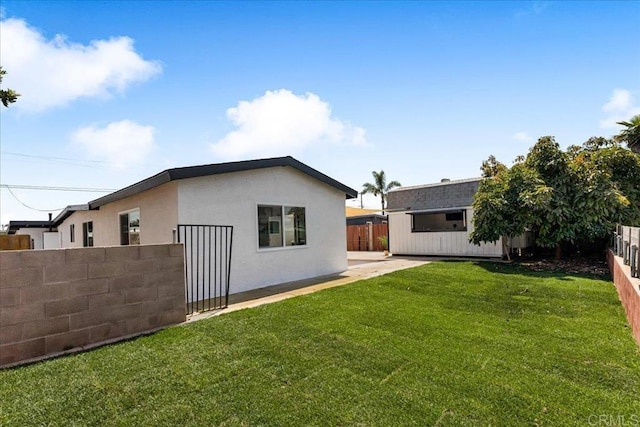 view of home's exterior with a lawn