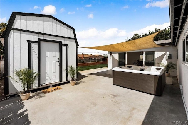 view of patio / terrace with a storage shed