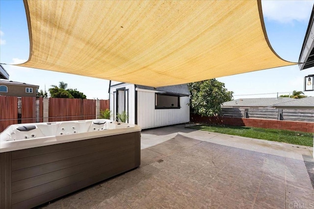 view of patio / terrace featuring a hot tub