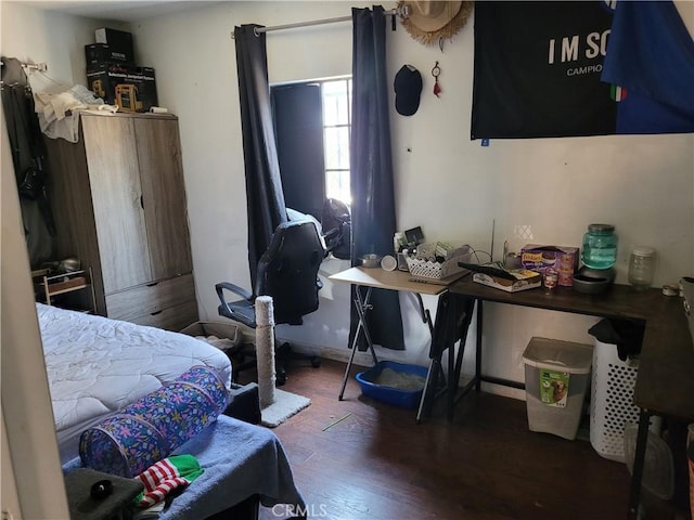 bedroom featuring dark wood-type flooring