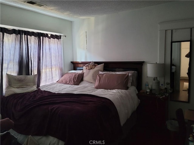 bedroom featuring a textured ceiling