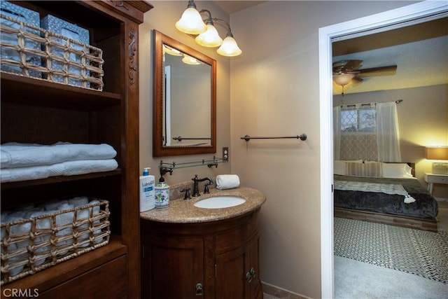 bathroom with ceiling fan and vanity