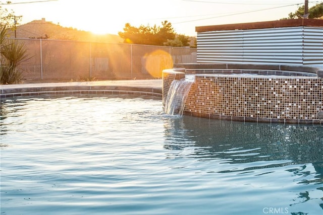 exterior space featuring pool water feature