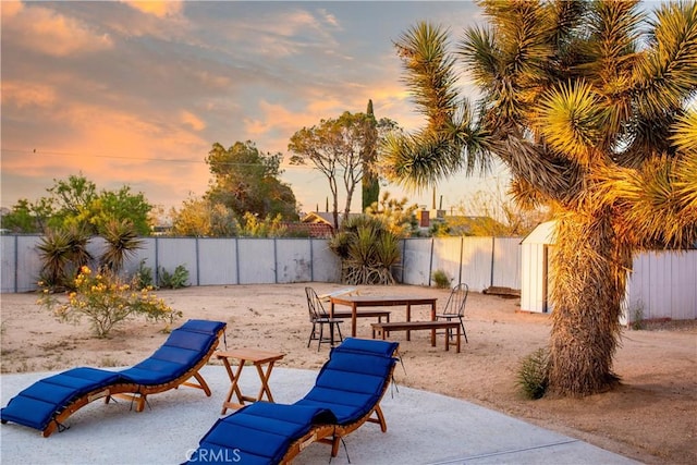 view of patio terrace at dusk