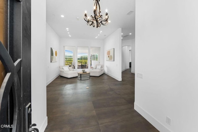 living room with an inviting chandelier