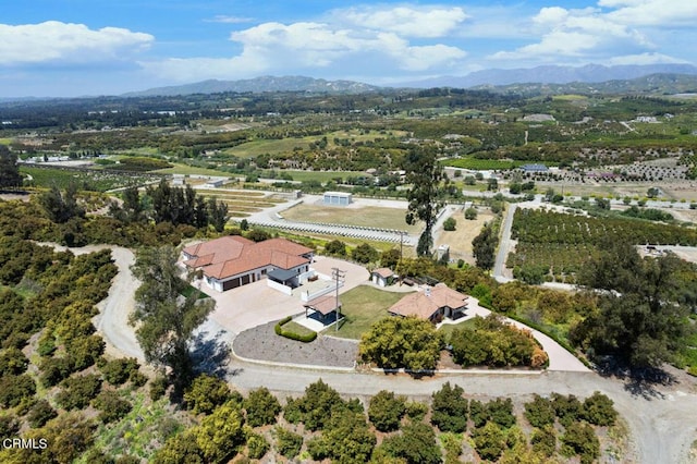 birds eye view of property featuring a mountain view