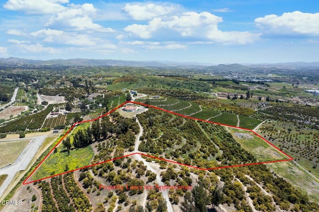 birds eye view of property with a mountain view