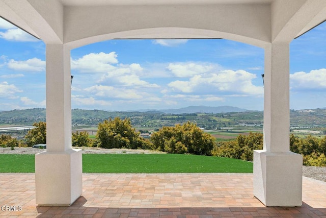 view of patio / terrace with a mountain view