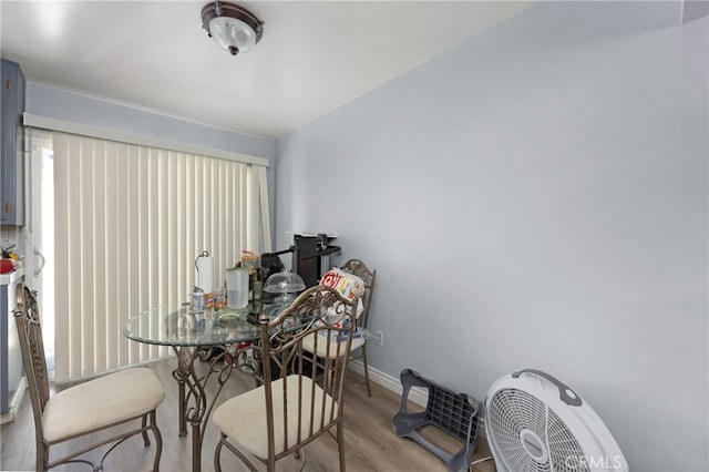 dining area with light hardwood / wood-style flooring