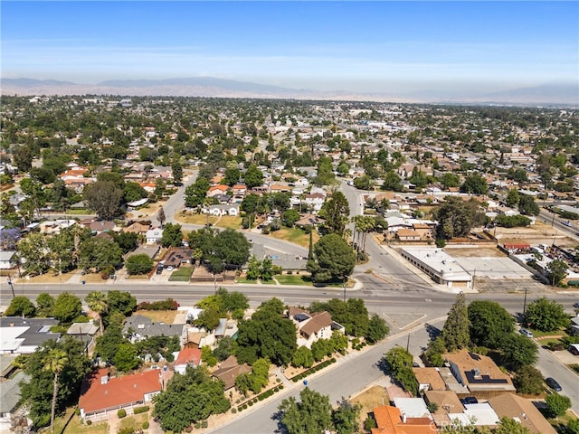 birds eye view of property with a mountain view